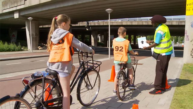 Pupils taking their cycling exam. Screenshot © YouTube